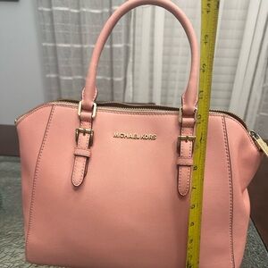 Michael Kors Coral purse and wallet in used condition,